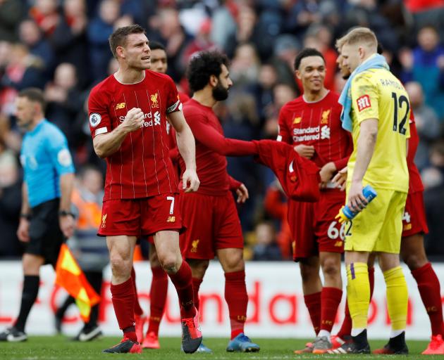 Liverpool's James Milner celebrates after the match. Photo: Reuters