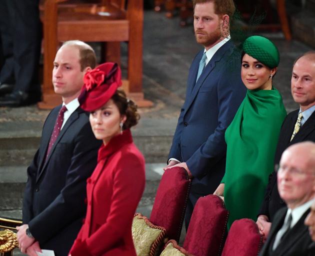 Prince Harry and Meghan (at rear) joined Prince William and his wife Catherine, Duchess of...