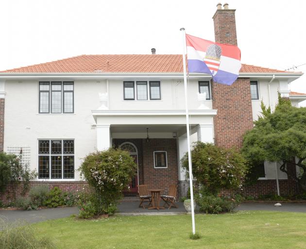The flag of Kronberg, Ms Reymann's home city in Germany, flies near the entrance. 