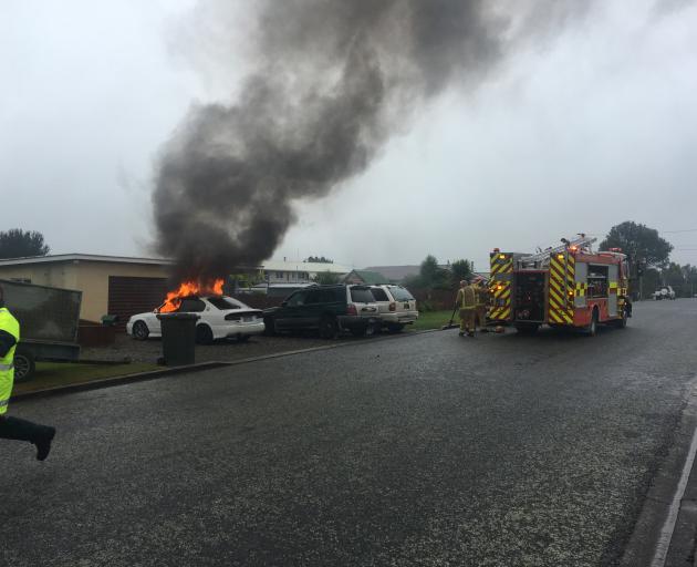 Firefighters at the scene of a car fire in Stirling. Photo: Richard Davison