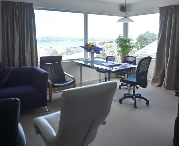 The 100sq m apartment is much smaller than their former home but the owners say the large windows...