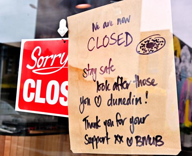 One of the many signs on businesses around Dunedin advising of closure. PHOTO: ODT FILES
