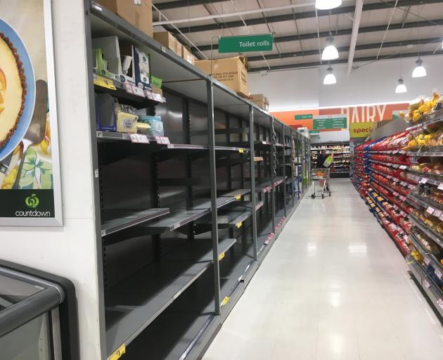 Shelves usually holding toilet rolls were empty at Dunedin central Countdown on Saturday. Photo:...