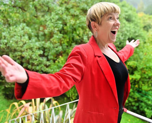 Lois Johnston, of Careys Bay, sang an aria for her neighbours from her balcony on Sunday. PHOTO:...