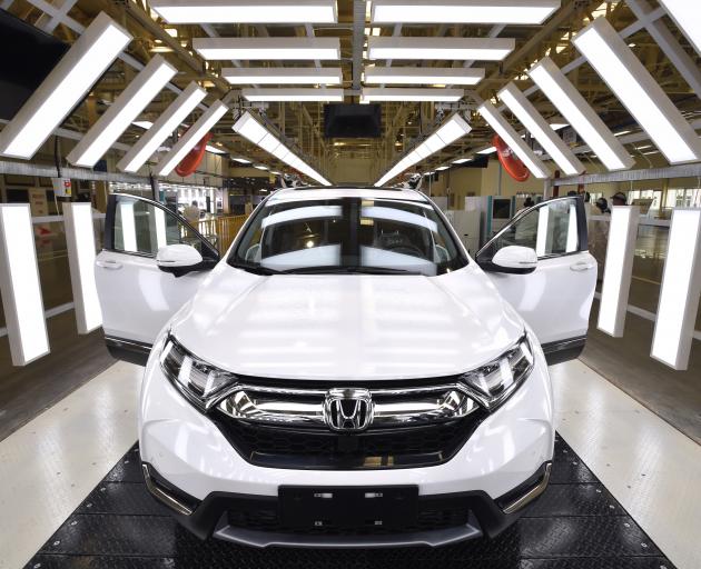 A new Honda comes off the line at Dongfeng, Honda’s third factory, last year in Wuhan, Hubei...