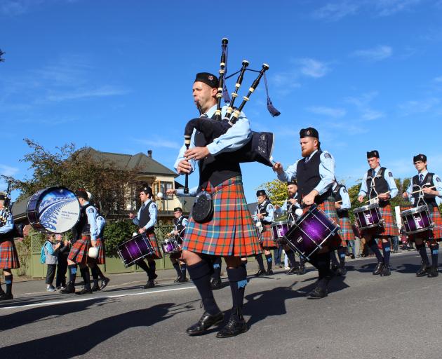 Police in a different uniform ... The New Zealand Police Pipe Band competes in the street march...