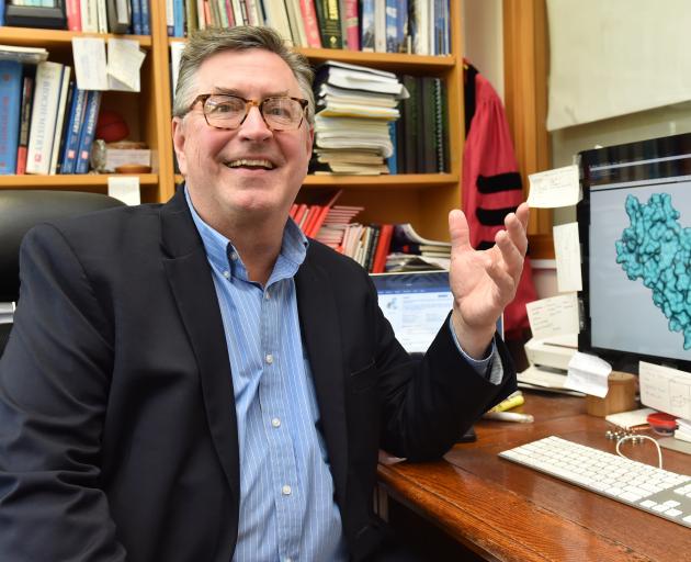 Prof Kurt Krause with an image of a coronavirus protein used in reproduction. PHOTO: GREGOR...