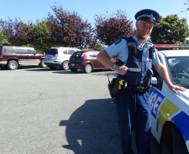 Sergeant Blair Wilkinson, of Oamaru, at Awamoa Park in Oamaru where vehicles parked up for sale...