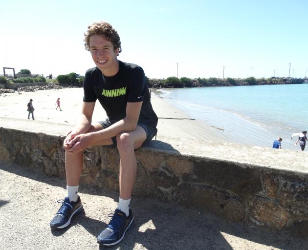 Austin Carter relaxes at Friendly Bay, Oamaru, after winning the men's open section of the Oamaru...