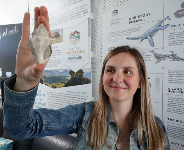 Waitaki Whitestone Geopark Trust geopark co-ordinator Lisa Heinz admires a several million-year...