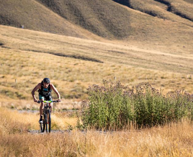 Sam Osborne bikes in the Motatapu triathlon event on Saturday. Photo: Tim Bardsley-Smith 