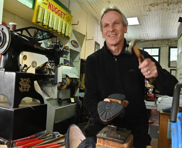 Paul Ayers repairs footwear in his Stuart St premises before making home deliveries to customers. Photo: Christine O'Connor