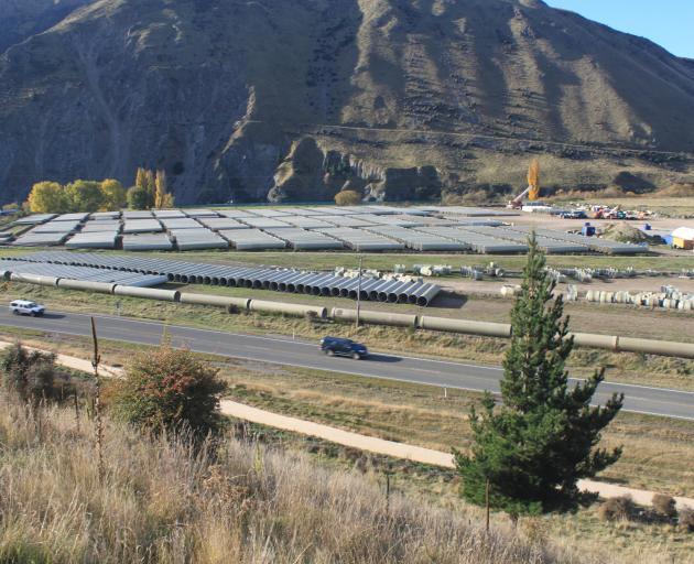 Pipes are stored near the base of the Waitaki dam, ready to be laid in the Kurow Duntroon...