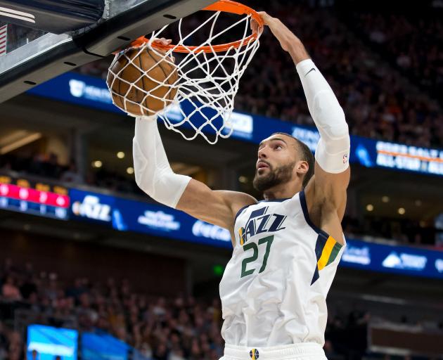 Utah Jazz centre Rudy Gobert (27), who has reportedly tested positive for coronavirus, dunks the...