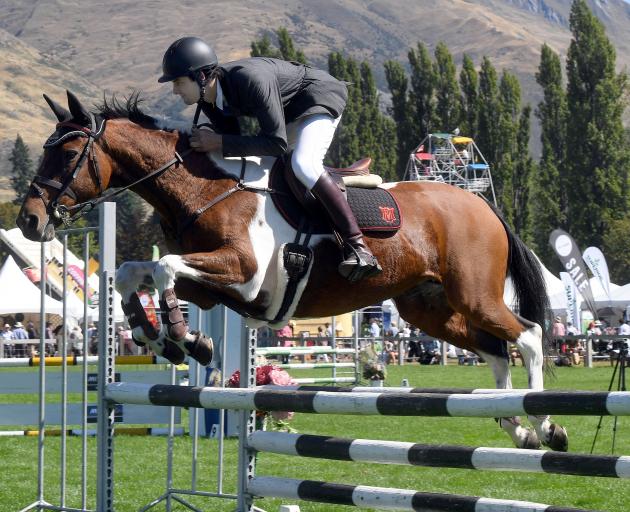 Alex Smith and his mount Frolic fly over a jump.

