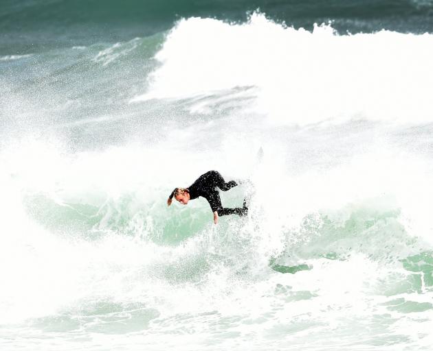 Surfer Jack Lee (17), of Whakatane, braves the choppy conditions at St Clair Beach on Saturday....