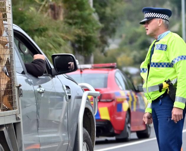 Police were stopping vehicles driving in and out of Mosgiel today to ensure people were complying...