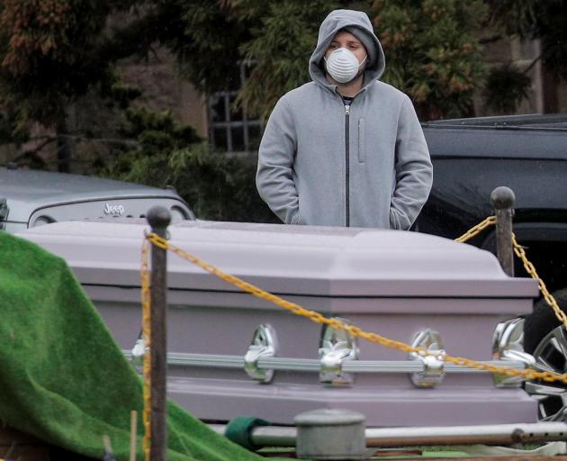 A mourner attends a funeral in Brooklyn, New York. Photo: Reuters 