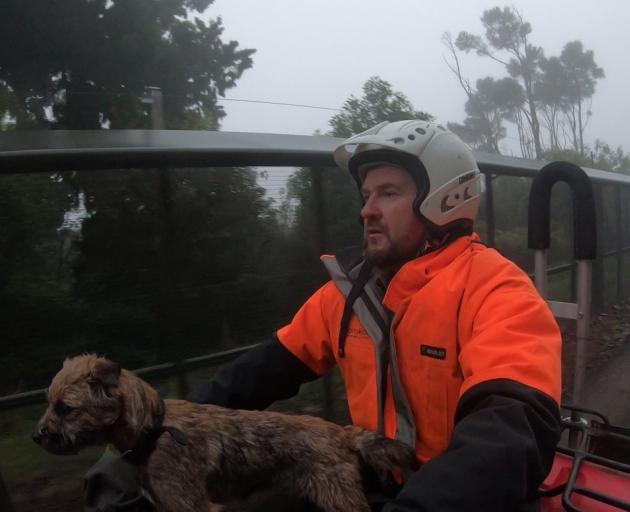 Orokonui Ecosanctuary conservation manager Elton Smith and border terrier Pip head off to check a...