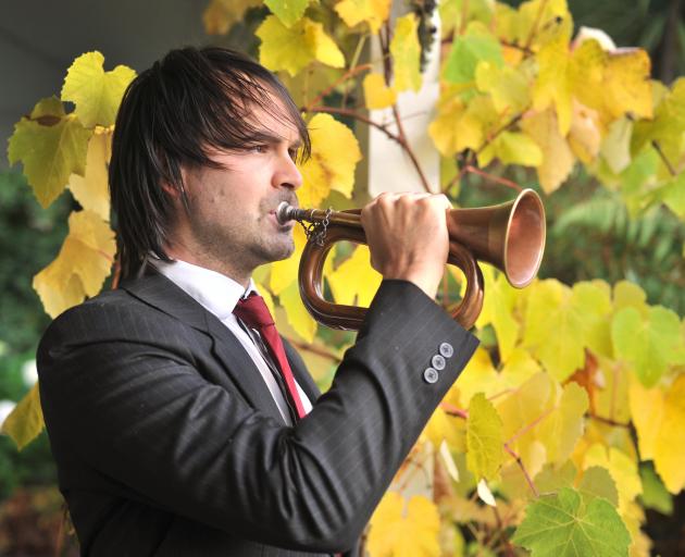 Tosh Stewart plays the Last Post on the bugle from his home in Carey's Bay on Anzac Day morning. Photo: Christine O'Connor Tosh Stewart plays the Last Post on the bugle from his home in Carey's Bay on Anzac Day morning. Photo: Christine O'Connor