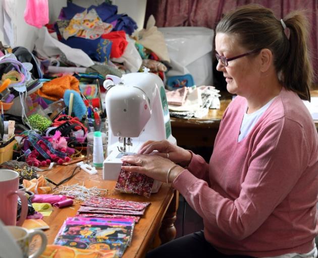 Sewing up a storm ... Dunedin grandmother Michelle Webb has made more than 350 masks for the...