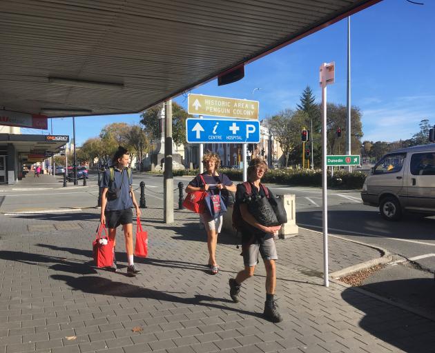 A group wanders along Thames St in Oamaru.T he town's central business district was busy with...