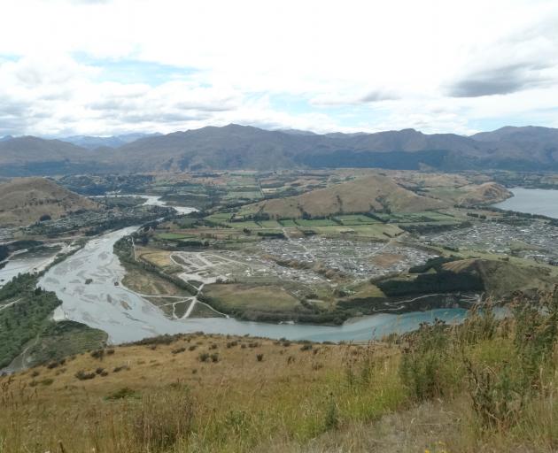 The Shotover River, with the expanding Shotover Country subdivision, at right. Photo by David Williams.