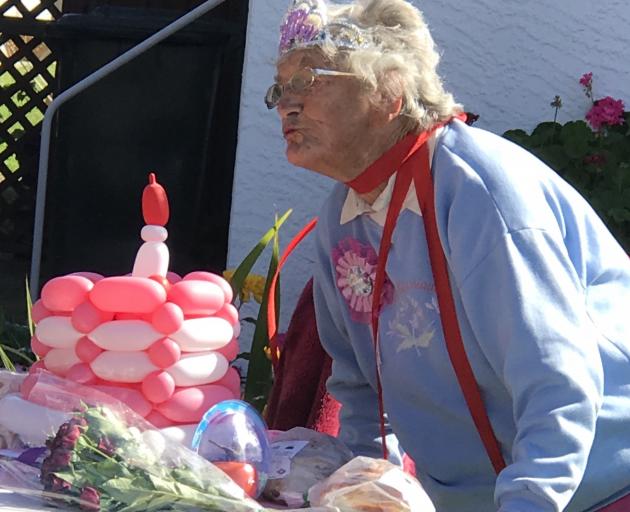 Ursula blows out the "candle" on her balloon birthday cake. Photo: Sylvia Mort