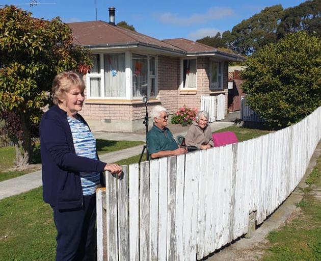 Neighbours keep their distance while wishing Ursula a happy birthday, Photo: Sylvia Mort