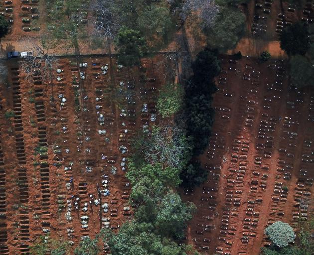 Open and occupied graves are seen during the outbreak of Covid-19, at Vila Formosa cemetery, Brazil's biggest cemetery, in Sao Paulo. Photo: Reuters