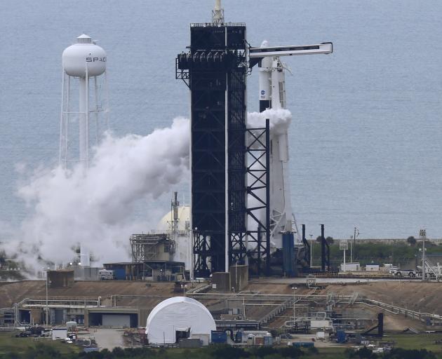 The SpaceX Falcon 9 rocket purges fuel after topping off as it prepares to launch, before the...