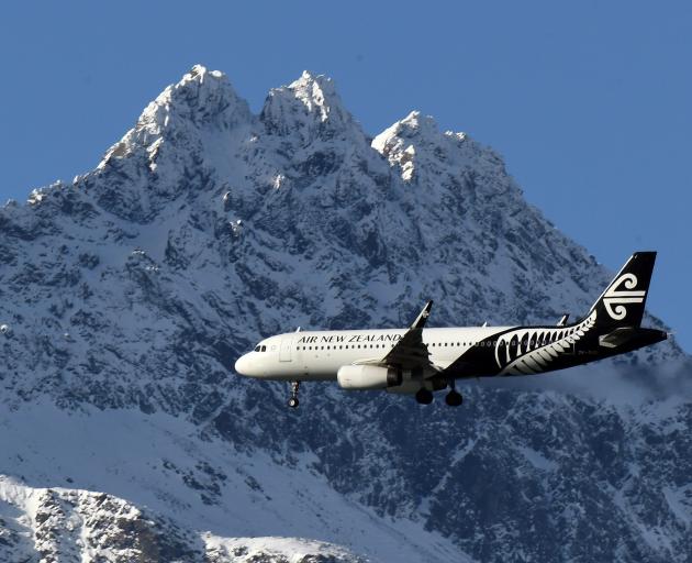 An Air New Zealand Airbus A320 passes the Remarkables on its way to land at Queenstown airport...