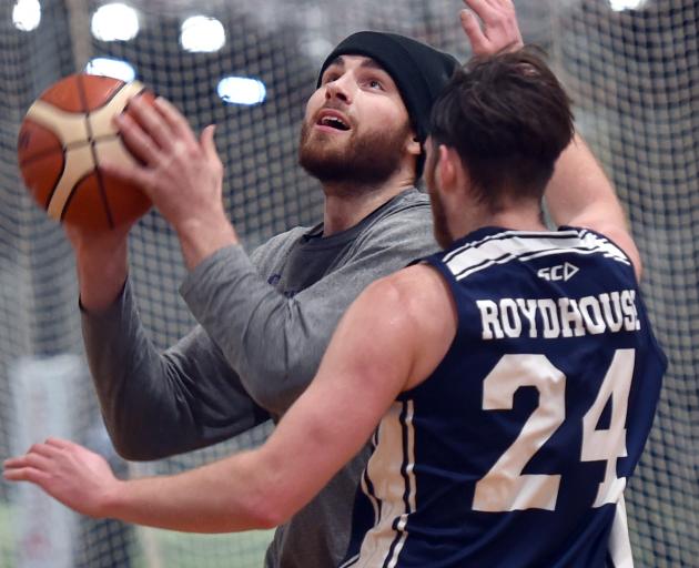 Otago Nuggets player Sam Timmins (left) and Aaron Roydhouse get in some training at the Edgar...
