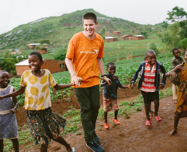 Izaac Wilson dances with Malawi children during his visit last year. PHOTO: SUPPLIED