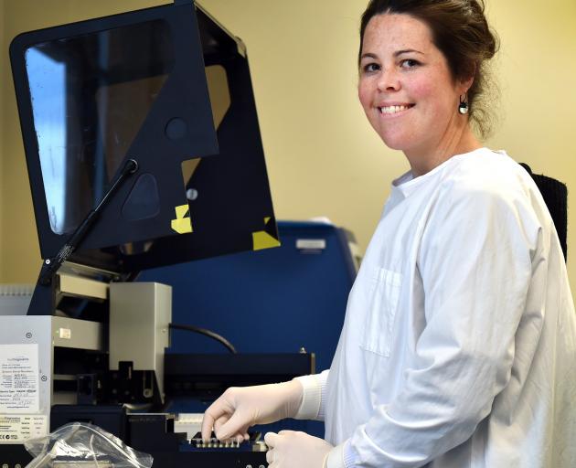Southern Community Laboratories molecular pathology department head Jenny Grant with an...
