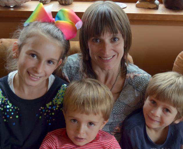 Jennifer Shulzitski with her children (from left) Violet (11), Silas (4) and Odin (7).