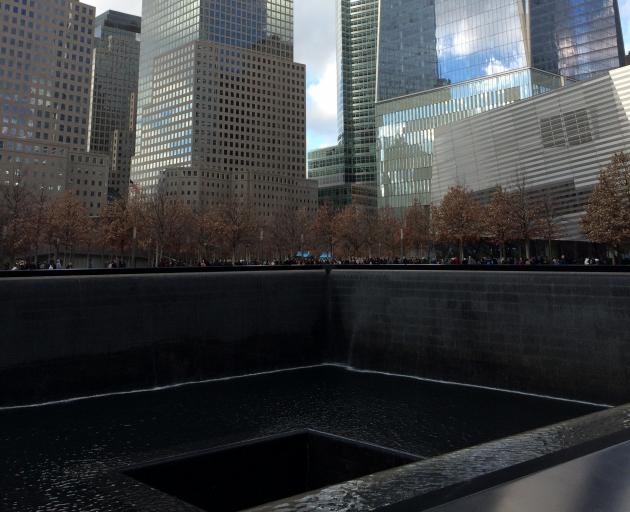 September 11th memorial and museum reflecting pools (Reflecting Absence) with view of Freedom...