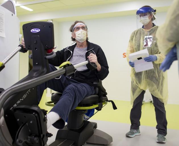 Gordon Quinn exercises with physical therapist Katie Palano on April 27, 2020, at the Shirley...