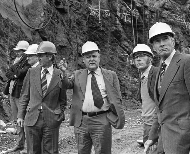 Robert Muldoon (centre) with officials at the Clyde Dam construction site during the 1980s. PHOTO...