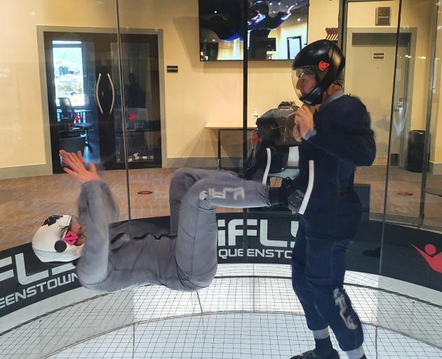 Lean back ... Erica Zanei practises her skills in the wind tunnel with iFly instructor Allen...