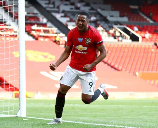 Anthony Martial celebrates one of three goals he scored in Manchester United's win over Sheffield...