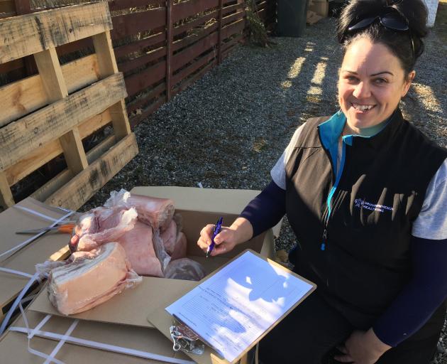 Uruuruwhenua Health mauri ora/whanau ora navigator Grace Gibbons is distributing pork roasts to...