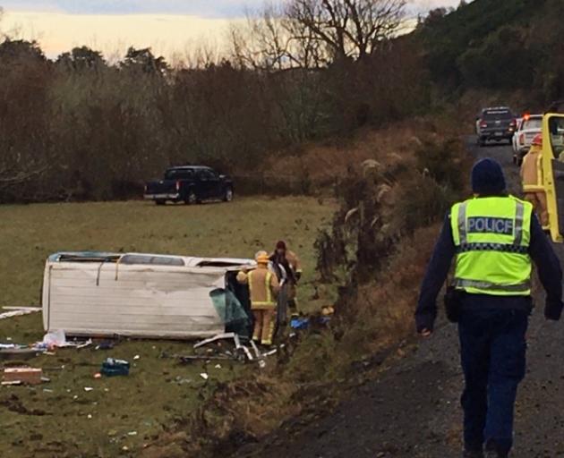 A black ute and a white work van came off the road outside Balclutha this morning. Photo: Richard Davison