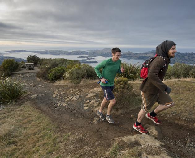 Brothers Rory and Callum McLean reach the summit of Mt Cargill during the Crush the Cargill event...