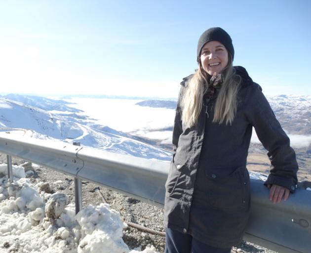 Arizona snowboarder Jamie Lewis surveys the inversion layer that has kept Upper Clutha residents...