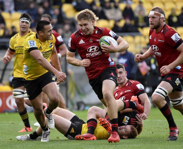 Jack Goodhue on his way to the try line in the Crusaders' win over the Hurricanes in Wellington...