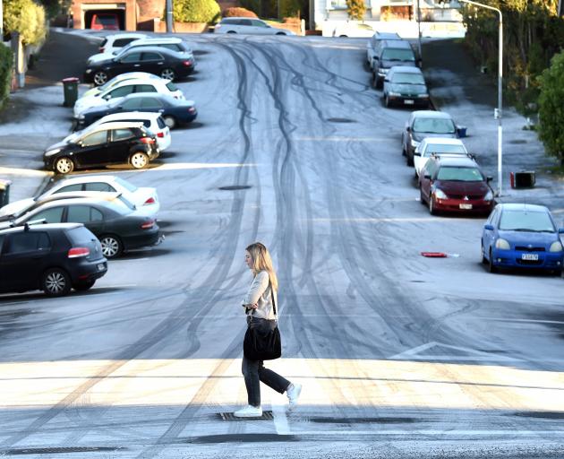 A woman had to watch her step as she crossed an icy Union St after a big frost in Dunedin...