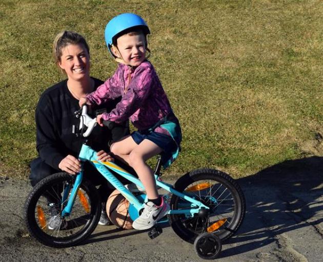 Grayson Wharerimu (4), supervised by his mum Jody, rides his new bike at Marlow Park in St Kilda yesterday.PHOTO: SHAWN MCAVINUE