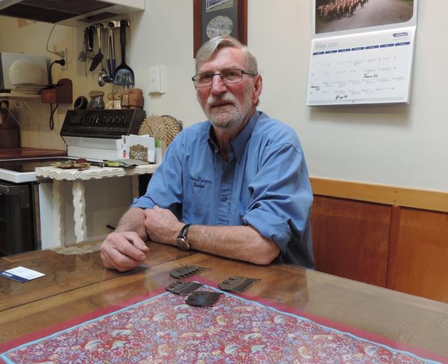 Time flies ... Colin Gibson, at his North Otago farmhouse table with shearing combs from New...