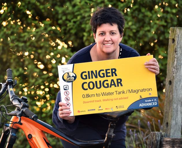 Mountain Biking Otago president Kristy Booth says goodbye to one of the signs deemed ‘...